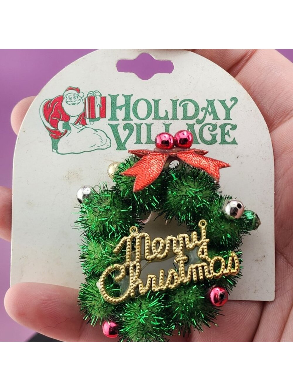 Green Tinsel Merry Christmas Wreath Brooch With Bells & Red Bow